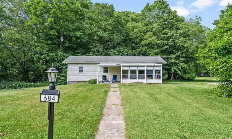 View of front of property featuring a front lawn