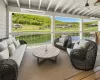 View of patio featuring ceiling fan, an outdoor living space, and a water view