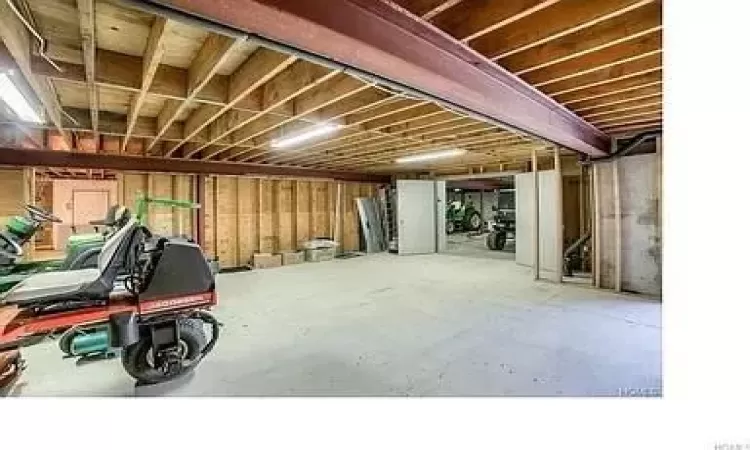 Basement garage/workshop area with walkout.