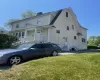 View of front facade featuring a front yard