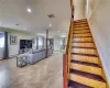 Staircase with tile flooring and a baseboard radiator