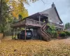 Back of property featuring a carport