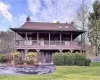 Rear view of property featuring a lawn