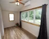 Second bedroom featuring a mini-split unit, wood-style flooring, and lofted ceiling