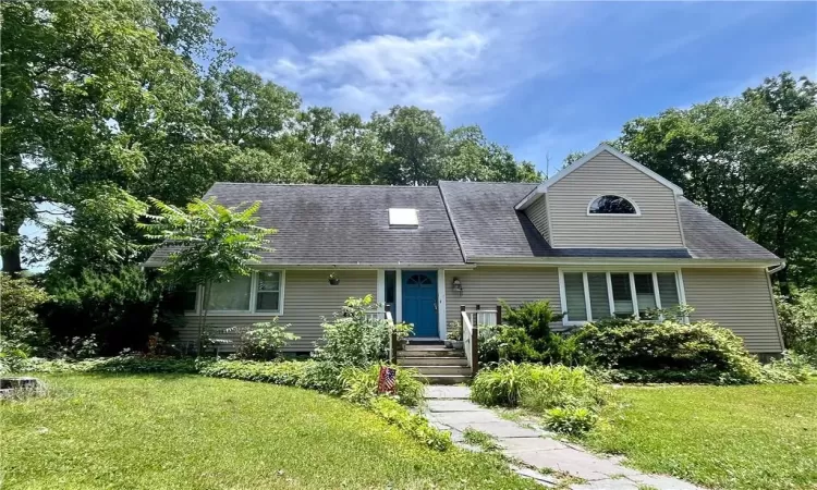 View of front of property with a front yard