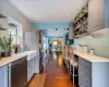 Kitchen featuring gray cabinets, dishwasher, tasteful backsplash, and dark hardwood / wood-style floors