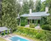 View of swimming pool featuring a diving board and a patio area