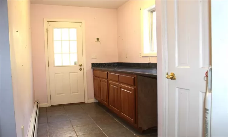 Large Butler's Pantry with lots of countertop space and closet.  Access to pool for BBQing.