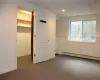 Large office with huge closet with shelves