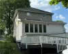 Rear view of property with a wooden deck