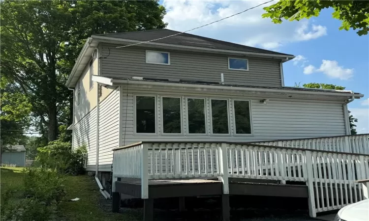 Rear view of property with a wooden deck