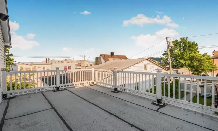 Balcony off of primary bedroom with water view