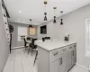 View of eat-in-kitchen with island and stools