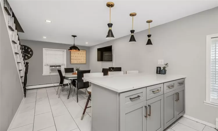 View of eat-in-kitchen with island and stools