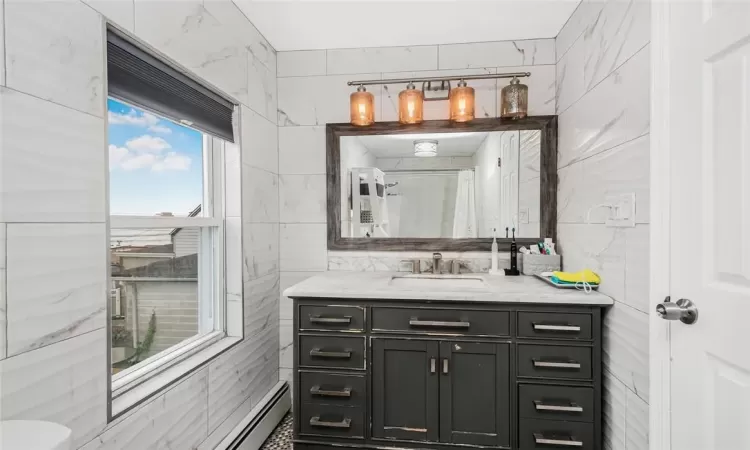 2nd floor updated full bathroom with marble vanity