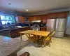 Kitchen with stainless steel appliances, backsplash, crown molding, and light tile patterned floors