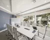 Carpeted office space featuring a paneled ceiling