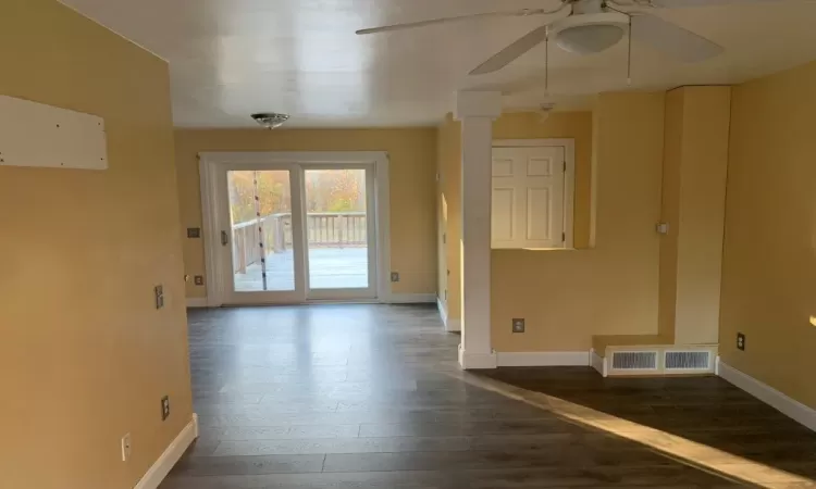 Unfurnished room with wood-type flooring and ceiling fan