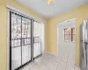 Tiled spare room with ceiling fan and a textured ceiling