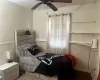 Bedroom featuring ceiling fan and wood-type flooring