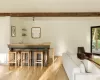 Living room featuring beamed ceiling and light hardwood / wood-style floors