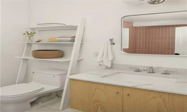 Bathroom with vanity and toilet