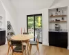 Dining space featuring light hardwood / wood-style floors and lofted ceiling