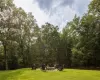 View of yard featuring an outdoor fire pit