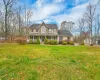 Colonial house with a porch and a front lawn