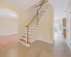 Stairs featuring hardwood / wood-style floors