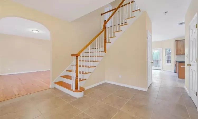 Stairs featuring hardwood / wood-style floors