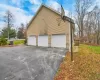 View of property exterior featuring a garage