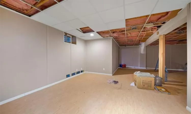 Basement featuring hardwood / wood-style floors