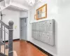 Foyer with a mail area and a textured ceiling