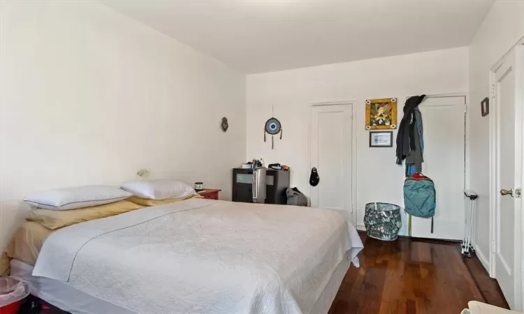 Bedroom featuring dark hardwood / wood-style flooring