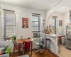 Dining room featuring cooling unit and light parquet floors