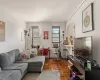 Living room with dark parquet floors and cooling unit