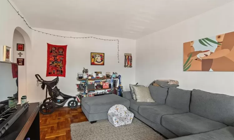 Living room featuring dark parquet floors