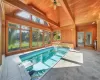 View of pool with ceiling fan