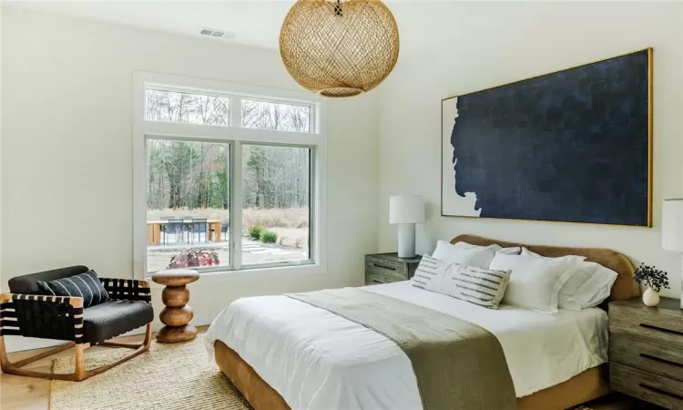 Bedroom with hardwood / wood-style floors