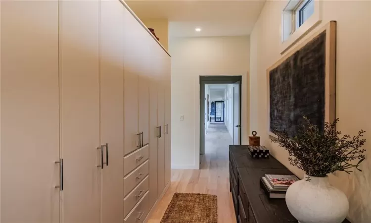 Hall featuring light wood-type flooring