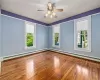 Dining room with hardwood floors open to the living room