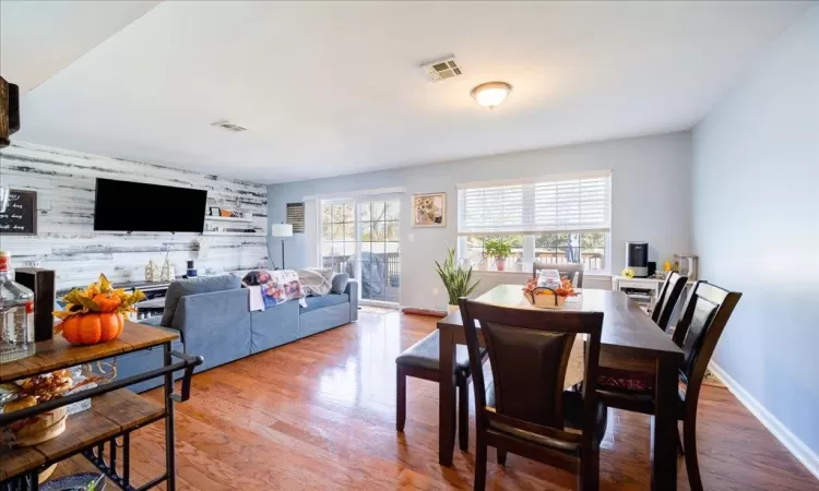 Dining area with hardwood / wood-style floors