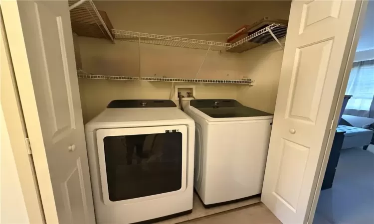 Laundry room with washing machine and dryer