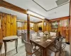 Dining area with wooden walls and a textured ceiling