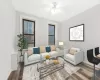 Living room featuring hardwood / wood-style floors and ceiling fan