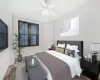 Bedroom featuring ceiling fan and dark wood-type flooring