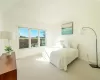 Bedroom featuring light colored carpet