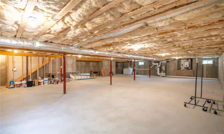 Basement with heating unit and electric panel