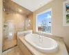 Primary En-Suite Bathroom with walk-in shower and Soaking Tub